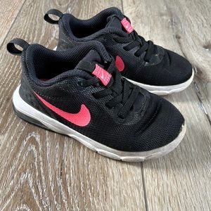 black nike with pink tick